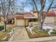 Front view of the house with driveway and landscaping at 2665 S Sheridan Ct, Lakewood, CO 80227