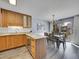Updated kitchen and dining area with modern light fixtures at 2665 S Sheridan Ct, Lakewood, CO 80227