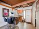 Small kitchenette with wood cabinets and a bar area at 2665 S Sheridan Ct, Lakewood, CO 80227