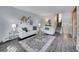 Living room with hardwood floors, sofas, and coffee table at 2665 S Sheridan Ct, Lakewood, CO 80227
