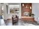Cozy living room featuring a fireplace and a comfortable armchair at 2665 S Sheridan Ct, Lakewood, CO 80227
