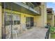 Ground floor patio with chairs and an open view of the complex at 2665 S Sheridan Ct, Lakewood, CO 80227