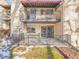 Back patio with wrought iron fencing, access from sliding glass door at 2665 S Sheridan Ct, Lakewood, CO 80227