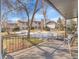 Private patio with seating area and view of the yard at 2665 S Sheridan Ct, Lakewood, CO 80227