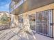 Back patio with seating and exterior access at 2665 S Sheridan Ct, Lakewood, CO 80227