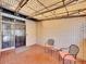Covered patio with brick flooring and two metal chairs at 2665 S Sheridan Ct, Lakewood, CO 80227