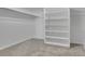 Spacious walk-in closet with built-in shelving and hanging rod at 2665 S Sheridan Ct, Lakewood, CO 80227
