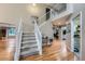 Bright foyer with hardwood floors and stairway leading to second floor at 6526 S Killarney Ct, Aurora, CO 80016