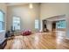 Bright living room with hardwood floors and plenty of natural light from two large windows at 6526 S Killarney Ct, Aurora, CO 80016