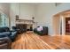 Spacious living room featuring a fireplace, hardwood floors and ample natural light at 6526 S Killarney Ct, Aurora, CO 80016