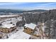 An aerial view of the back of the property with a scenic view of the distant surrounding hills at 726 Dreamcatcher Ln, Evergreen, CO 80439