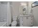 Bathroom features a toilet, vanity with a marble countertop, and a shower with a patterned tile wall at 726 Dreamcatcher Ln, Evergreen, CO 80439
