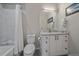 Well-lit bathroom features modern vanity with marble counters and a tiled shower/tub at 726 Dreamcatcher Ln, Evergreen, CO 80439