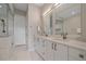 Elegant bathroom with double vanity, modern fixtures, and a glass-enclosed shower at 726 Dreamcatcher Ln, Evergreen, CO 80439