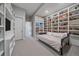 Cozy bedroom with built-in shelving and soft neutral carpet at 726 Dreamcatcher Ln, Evergreen, CO 80439