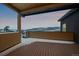 Enjoy mountain views from this covered deck with wood flooring and privacy railing at 726 Dreamcatcher Ln, Evergreen, CO 80439