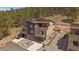 Modern townhome exterior with an attached two-car garage and concrete driveway at 726 Dreamcatcher Ln, Evergreen, CO 80439