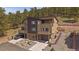 Modern townhome with a two-car garage and beautiful landscaping at 726 Dreamcatcher Ln, Evergreen, CO 80439