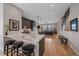 Open floor plan blending kitchen island, seating, and living space for seamless living at 726 Dreamcatcher Ln, Evergreen, CO 80439