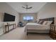 Serene bedroom with large window, soft carpet, and a seating area for relaxing at 726 Dreamcatcher Ln, Evergreen, CO 80439