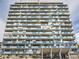 Striking exterior view of a high-rise building showcases its unique architecture and design at 1155 Ash St # 202, Denver, CO 80220