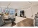 Inviting living room with neutral tones, tiled floor and modern track lighting perfect for relaxing or entertaining at 1155 Ash St # 202, Denver, CO 80220