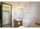 Functional bathroom with a vanity, toilet, and walk-in closet, providing efficient space utilization at 108 Ward Ct, Lakewood, CO 80228