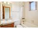 Simple bathroom with a vanity, toilet, and shower-tub, providing essential amenities in a compact space at 108 Ward Ct, Lakewood, CO 80228