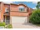 Charming home featuring a two-car garage, a brick trim, unique arch windows and mature landscaping at 108 Ward Ct, Lakewood, CO 80228