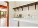 Convenient laundry room with washer and dryer, positioned near the living area for easy access at 108 Ward Ct, Lakewood, CO 80228
