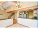 Bright living room with wooden beams, hardwood floors, and an open layout, perfect for entertaining at 108 Ward Ct, Lakewood, CO 80228