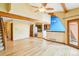 Spacious home showcasing an open floor plan, hardwood floors, wood beams, and a second story stairwell at 108 Ward Ct, Lakewood, CO 80228