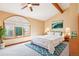 Staged main bedroom with a vaulted ceiling, large window, and neutral tones, creating a serene retreat at 108 Ward Ct, Lakewood, CO 80228