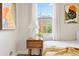 Comfortable bedroom with wood nightstand and window views at 1805 W 51St Ave, Denver, CO 80221