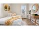 Bright bedroom featuring a bed, desk area, natural light from a window and modern decor at 1805 W 51St Ave, Denver, CO 80221