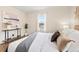 Relaxing bedroom with a large window providing ample natural light and neutral color palette at 1805 W 51St Ave, Denver, CO 80221