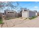 Detached garage with white door providing ample storage space and parking at 1805 W 51St Ave, Denver, CO 80221