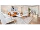 Bright living room features modern decor, hardwood floors, and a sliding glass door to the outside at 1805 W 51St Ave, Denver, CO 80221