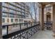 Balcony with wrought iron railing offering views of the surrounding cityscape, providing an outdoor living space at 1210 E Colfax Ave # 301, Denver, CO 80218