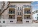 Classic building facade featuring multiple balconies and detailed architectural design, showcasing historic charm at 1210 E Colfax Ave # 301, Denver, CO 80218