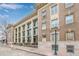 Stately building with neoclassical architecture and grand windows, offering a blend of historic charm and modern appeal at 1210 E Colfax Ave # 301, Denver, CO 80218