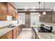 Updated kitchen showcasing granite countertops, stainless steel appliances, and ample cabinetry at 1210 E Colfax Ave # 301, Denver, CO 80218