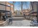 Outdoor patio space with seating and steps leading to upper level, providing an inviting area for relaxation at 1210 E Colfax Ave # 301, Denver, CO 80218
