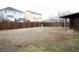 Large fenced backyard featuring buildings and gazebo in background at 3825 E 123Rd Ave, Thornton, CO 80241