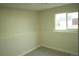 Bright bedroom featuring neutral carpet, fresh white paint and large window at 3825 E 123Rd Ave, Thornton, CO 80241