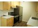 Kitchen with stainless steel appliances, white countertops, and light colored cabinets at 3825 E 123Rd Ave, Thornton, CO 80241