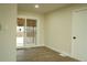 Bright living room with wood floors, a sliding glass door, and a view to the backyard at 3825 E 123Rd Ave, Thornton, CO 80241