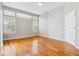 Bright bedroom with hardwood floors and plantation shutters at 2503 S Toledo Way, Aurora, CO 80014