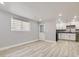 Finished basement with kitchenette and vinyl flooring at 3227 N Steele St, Denver, CO 80205