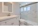 Clean bathroom with white vanity and marble shower at 3227 N Steele St, Denver, CO 80205